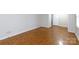 Bright bedroom featuring hardwood floors, neutral walls, and an ensuite bathroom entrance at 1825 Hyatt Ave, Rock Hill, SC 29732