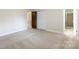 Bright bedroom featuring neutral walls, carpet, and an ensuite bathroom at 1825 Hyatt Ave, Rock Hill, SC 29732