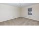 Bright bedroom features neutral walls, carpet, and a window at 1825 Hyatt Ave, Rock Hill, SC 29732