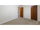 Well-lit bedroom features neutral walls and carpet at 1825 Hyatt Ave, Rock Hill, SC 29732