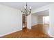 Comfortable dining room with chandelier, neutral paint, and hardwood floors at 1825 Hyatt Ave, Rock Hill, SC 29732
