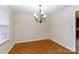 Comfortable dining room with chandelier, neutral paint, and hardwood floors at 1825 Hyatt Ave, Rock Hill, SC 29732