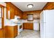Functional kitchen with wood cabinetry, white appliances, and easy-to-clean tile flooring at 1825 Hyatt Ave, Rock Hill, SC 29732