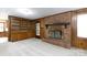 Inviting living room featuring a brick fireplace and built-in wooden bookcase at 1825 Hyatt Ave, Rock Hill, SC 29732