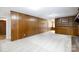 Spacious living room with wood-paneled walls and neutral carpeting at 1825 Hyatt Ave, Rock Hill, SC 29732