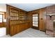Cozy living room with fireplace, built-in wooden bookcase, and access to the outdoors at 1825 Hyatt Ave, Rock Hill, SC 29732