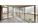Enclosed porch with wood flooring and railing offers a tranquil outdoor space to relax at 1825 Hyatt Ave, Rock Hill, SC 29732