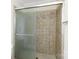 Close-up of tiled walk-in shower with glass door and chrome fixtures at 1825 Hyatt Ave, Rock Hill, SC 29732
