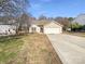 Charming one-story home featuring a two-car garage and a well-maintained front yard at 1830 Rosewell Dr, Rock Hill, SC 29732