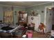 Bedroom features wood floors, green walls, vintage decor, and window with curtains at 1909 Marshall Ave, Gastonia, NC 28052