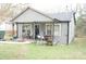 Charming gray single-story home with a covered front porch and landscaped front yard at 1909 Marshall Ave, Gastonia, NC 28052