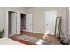 Bedroom with hardwood floors showing doors to an ensuite bath and stairs to another floor at 2014 Bryant Park Dr, Charlotte, NC 28208