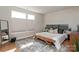 Bright bedroom with hardwood floors, a large area rug, and many windows providing ample light at 2014 Bryant Park Dr, Charlotte, NC 28208