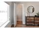 Bright bedroom with hardwood floors, a modern dresser and mirror, and an open closet at 2014 Bryant Park Dr, Charlotte, NC 28208
