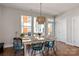 Dining area features a table, chairs, pendant lighting, and bright natural light from the nearby windows at 2014 Bryant Park Dr, Charlotte, NC 28208