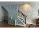 Foyer with a mural, staircase, and a decorative table with a blue vase at 2014 Bryant Park Dr, Charlotte, NC 28208