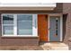 The front entrance has a decorative window with the address, wood panel, and a gray front door at 2014 Bryant Park Dr, Charlotte, NC 28208
