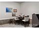 Section of a garage with a table and chairs with decor on the walls at 2014 Bryant Park Dr, Charlotte, NC 28208