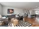 Spacious open floorplan featuring living room, kitchen, and dining areas with hardwood floors and modern decor at 2014 Bryant Park Dr, Charlotte, NC 28208
