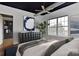 Cozy bedroom featuring a large window, ceiling fan, and stylish decor at 2338 Yadkin Ave # 205, Charlotte, NC 28205