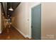 Hallway with modern lighting and a door at 2338 Yadkin Ave # 205, Charlotte, NC 28205