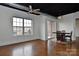 Bright living space with stained concrete floors, ceiling fan, and large windows at 2338 Yadkin Ave # 205, Charlotte, NC 28205
