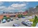 A view overlooking a parking lot with a variety of cars and some greenery, suggesting a vibrant community at 2338 Yadkin Ave # 205, Charlotte, NC 28205