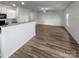 Bright living room view showcasing an open floorplan with wood floors and neutral walls at 2451 Rhyne Rd, Dallas, NC 28034