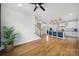 Open-concept living room with hardwood floors and stairs that lead to the home's second floor at 261 Helton Ln, Fort Mill, SC 29708