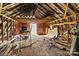Attic space with exposed beams, wood flooring, and a doorway at 2845 Wood Gate Rd, Lincolnton, NC 28092