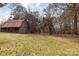Outbuilding in a large lot with tall trees with a grassy lawn at 2845 Wood Gate Rd, Lincolnton, NC 28092