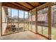 Screened-in porch with brick flooring and view of the lawn and an outbuilding at 2845 Wood Gate Rd, Lincolnton, NC 28092