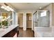 Elegant bathroom with glass shower, soaking tub, double sinks with marble counters, and access to a walk-in closet at 3542 Rapport Ct # 37, Lancaster, SC 29720