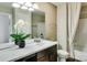 Well-lit bathroom with white marble countertops, dark wood cabinetry, and a shower-tub combination with white tiling at 3542 Rapport Ct # 37, Lancaster, SC 29720