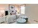 Charming bedroom featuring a polka dot patterned comforter, soft pink walls, plush ottomans and a bright window at 3542 Rapport Ct # 37, Lancaster, SC 29720