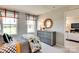Bright bedroom with two windows, neutral walls, a decorative mirror, and a cozy bed with a patterned comforter at 3542 Rapport Ct # 37, Lancaster, SC 29720