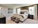 Spacious bedroom showcasing a plush bed, decorative stools, warm lighting, and a serene ambiance with natural light at 3542 Rapport Ct # 37, Lancaster, SC 29720