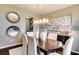 Elegant dining room features modern light fixture and decorative wall art at 3542 Rapport Ct # 37, Lancaster, SC 29720