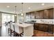This expansive kitchen boasts an island with seating, stainless steel appliances, and wood flooring at 3542 Rapport Ct # 37, Lancaster, SC 29720
