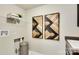 Well-organized laundry area with shelving, textured wall decor, a laundry basket, and a washing machine hookup at 3542 Rapport Ct # 37, Lancaster, SC 29720