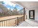 Covered back porch featuring black railing and entrance, providing a cozy outdoor living space at 3646 46Th Ne Ave, Hickory, NC 28601