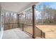 Spacious covered back porch with wooden columns overlooking a large backyard, ideal for outdoor relaxation at 3646 46Th Ne Ave, Hickory, NC 28601