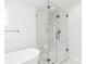 Glass shower and a stand alone tub with marble tile walls at 3646 46Th Ne Ave, Hickory, NC 28601