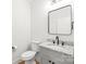Modern bathroom featuring a granite vanity, sleek mirror, contemporary fixtures, and toilet at 3646 46Th Ne Ave, Hickory, NC 28601