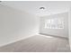 Neutral bedroom featuring plush carpet and a large window at 3646 46Th Ne Ave, Hickory, NC 28601