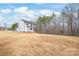 Two-story modern farmhouse exterior with a large yard, showcasing the home's appealing setting at 3646 46Th Ne Ave, Hickory, NC 28601