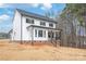 Modern two-story home with black framed windows and covered porch, boasting elegant curb appeal at 3646 46Th Ne Ave, Hickory, NC 28601