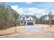 Beautiful new farmhouse construction with white siding, black trim and a spacious driveway at 3646 46Th Ne Ave, Hickory, NC 28601