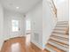 Bright foyer featuring hardwood floors, staircase, and access to other rooms within the house at 3646 46Th Ne Ave, Hickory, NC 28601