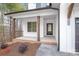 Inviting front porch with brick trim, wood columns, and a stylish black front door at 3646 46Th Ne Ave, Hickory, NC 28601